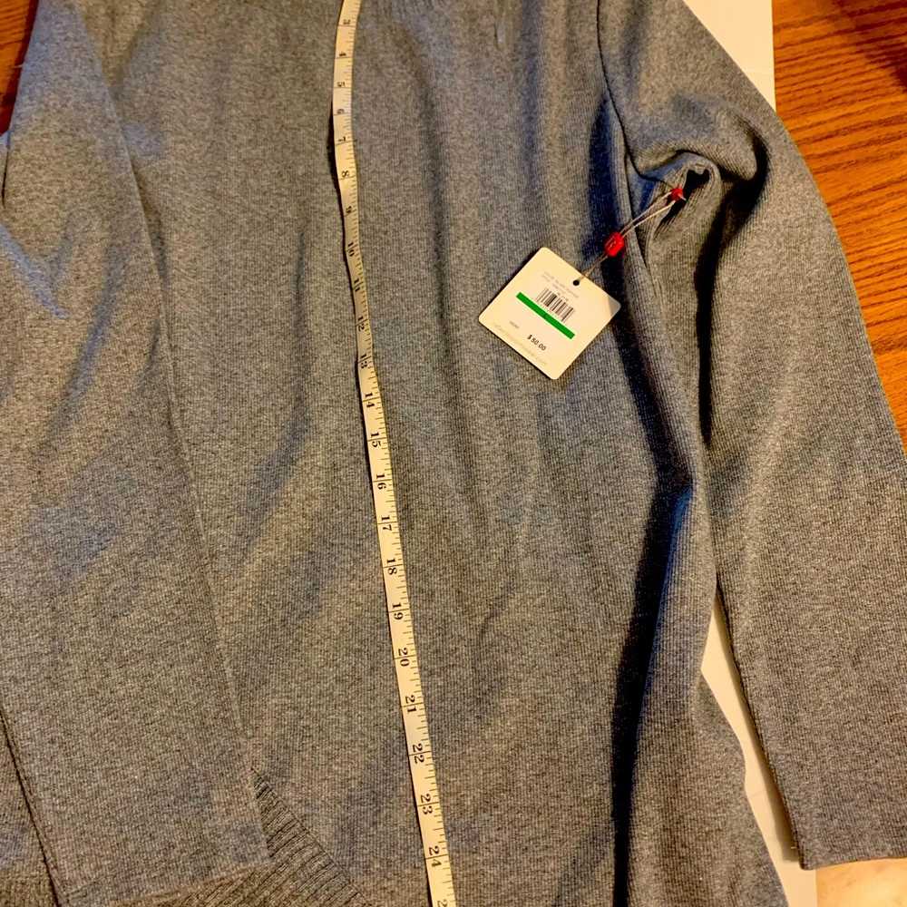 A sweater silver heather color 58% cotton 38% polyester 4% ElASTANE